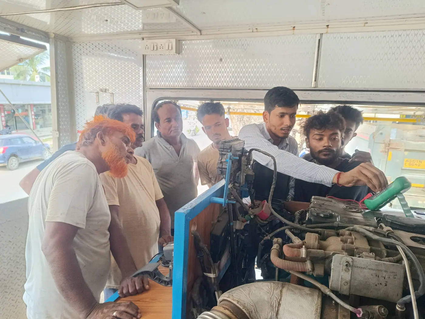 Trainees working hands-on with a heavy commercial vehicle engine